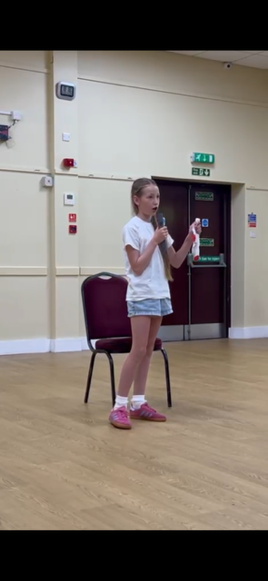 Student presenting in a Pure Performance class